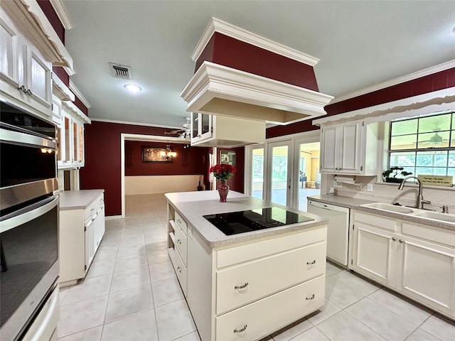kitchen with ornamental molding, a center island, black electric stovetop, and dishwasher
