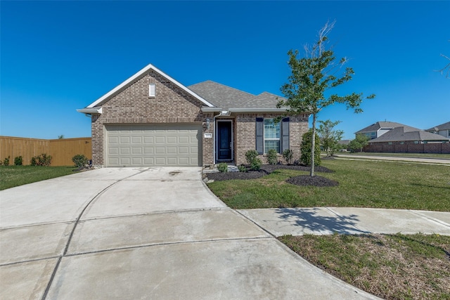 2411 Ocean Key Dr, La Marque, TX 77568 - single story home featuring a front yard, a garage, fence, concrete driveway, and brick siding