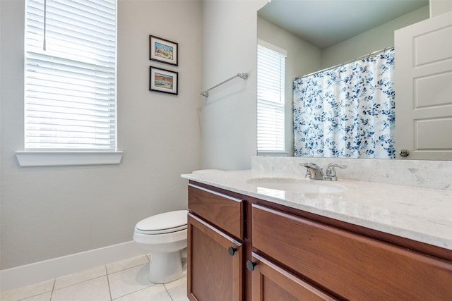 2411 Ocean Key Dr, La Marque, TX 77568 - bathroom with baseboards, a shower with curtain, toilet, vanity, and tile patterned floors