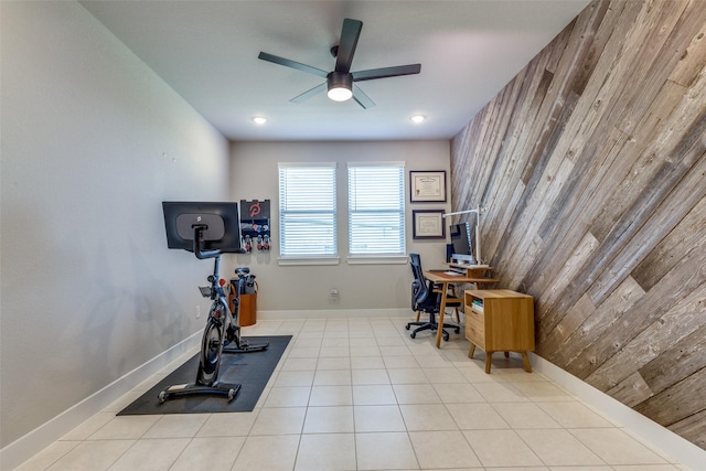 2411 Ocean Key Dr, La Marque, TX 77568 - office featuring tile patterned floors, wood walls, ceiling fan, and baseboards