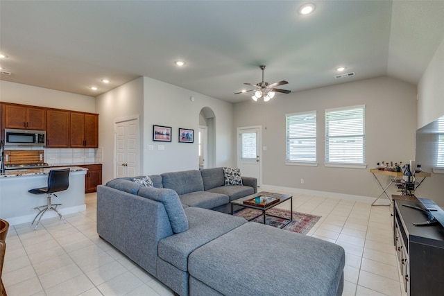 2411 Ocean Key Dr, La Marque, TX 77568 - living room featuring visible vents, arched walkways, ceiling fan, recessed lighting, and light tile patterned flooring