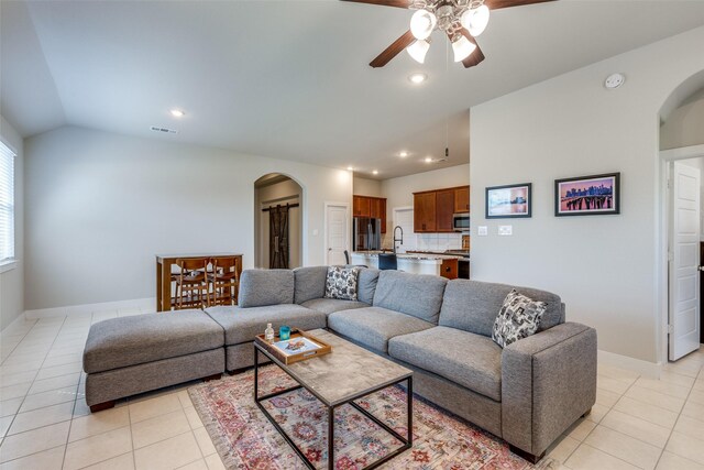 2411 Ocean Key Dr, La Marque, TX 77568 - living room featuring arched walkways, ceiling fan, vaulted ceiling, and visible vents