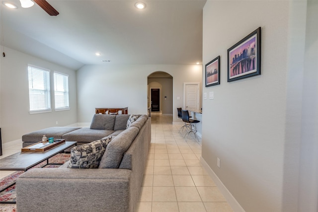 2411 Ocean Key Dr, La Marque, TX 77568 - living room featuring light tile patterned floors, baseboards, arched walkways, ceiling fan, and recessed lighting