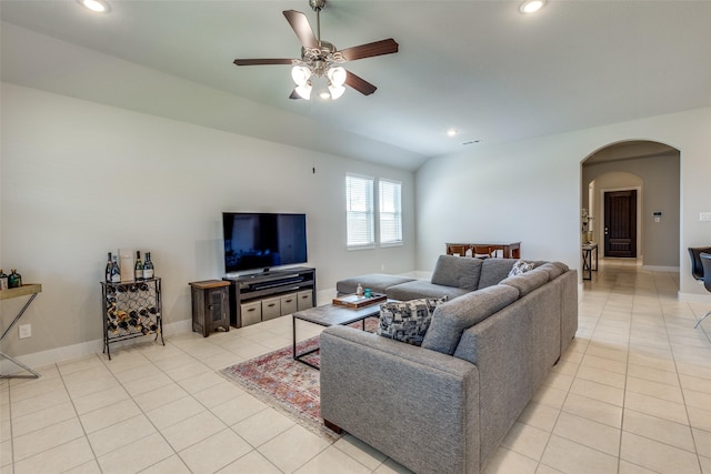 2411 Ocean Key Dr, La Marque, TX 77568 - living area with light tile patterned floors, a ceiling fan, arched walkways, and recessed lighting