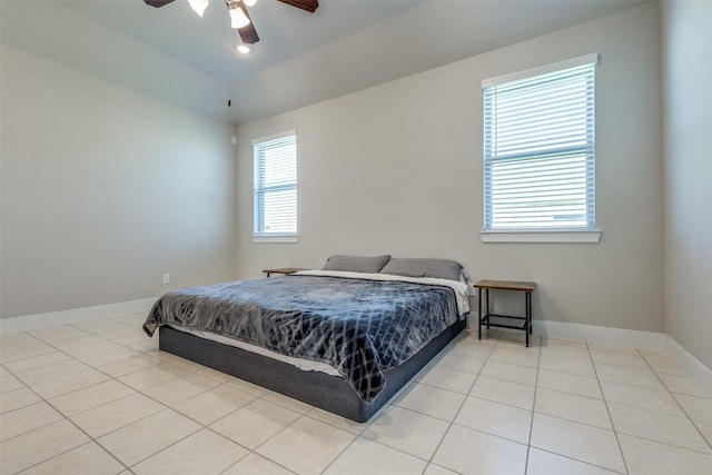 2411 Ocean Key Dr, La Marque, TX 77568 - bedroom with baseboards, a ceiling fan, and light tile patterned flooring