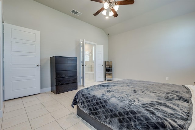 2411 Ocean Key Dr, La Marque, TX 77568 - bedroom with ceiling fan, light tile patterned floors, visible vents, lofted ceiling, and baseboards