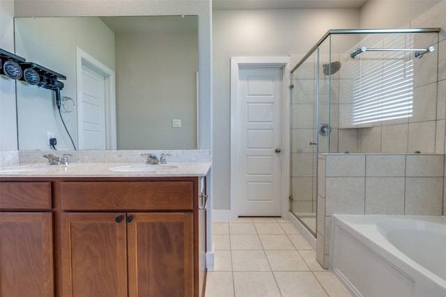 2411 Ocean Key Dr, La Marque, TX 77568 - bathroom featuring a shower stall, a bath, tile patterned flooring, a sink, and double vanity