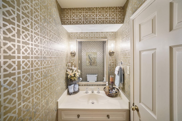 bathroom with vanity and toilet