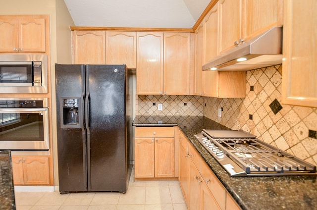 kitchen featuring under cabinet range hood, light brown cabinetry, and appliances with stainless steel finishes