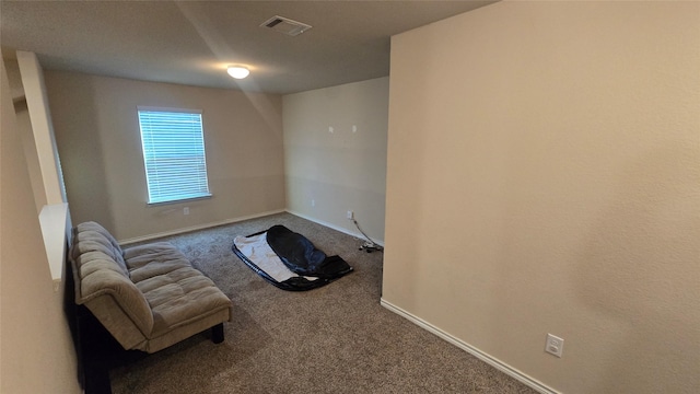 unfurnished room featuring visible vents, baseboards, and carpet floors