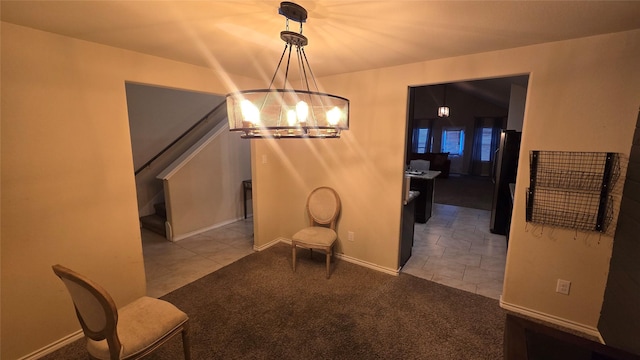 unfurnished dining area featuring an inviting chandelier, carpet, tile patterned flooring, and stairway