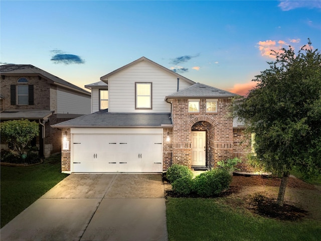 1830 Bravos Manor Ln, Fresno, TX 77545 - traditional-style house featuring driveway, brick siding, a garage, a shingled roof, and a yard
