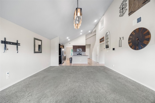 1830 Bravos Manor Ln, Fresno, TX 77545 - unfurnished living room featuring high vaulted ceiling, baseboards, light colored carpet, and recessed lighting