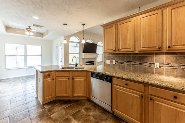 23222 Drywood Crossing Ct, Spring, TX 77373 - kitchen with a sink, dishwasher, a tray ceiling, ceiling fan, and tasteful backsplash