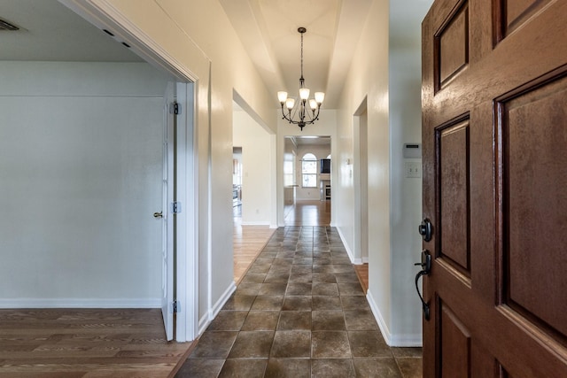 23222 Drywood Crossing Ct, Spring, TX 77373 - foyer entrance featuring a chandelier, baseboards, and arched walkways