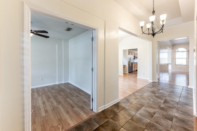 23222 Drywood Crossing Ct, Spring, TX 77373 - hallway with a chandelier, baseboards, and dark wood-type flooring