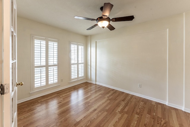 23222 Drywood Crossing Ct, Spring, TX 77373 - unfurnished room featuring light wood-style floors, baseboards, and a ceiling fan