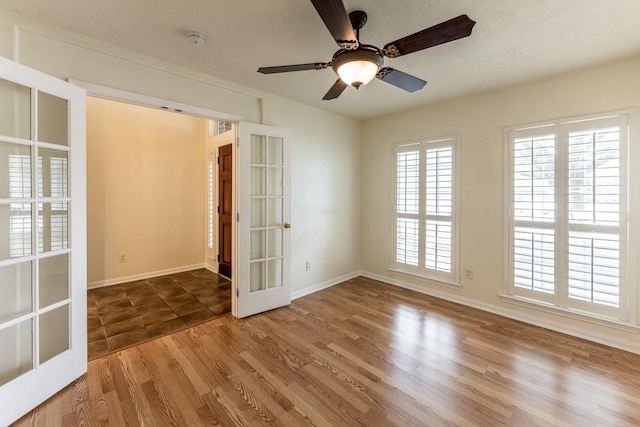 23222 Drywood Crossing Ct, Spring, TX 77373 - spare room with french doors, wood finished floors, baseboards, and a smoke detector