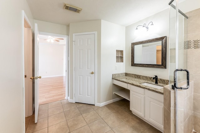 23222 Drywood Crossing Ct, Spring, TX 77373 - full bathroom with a stall shower, tile patterned flooring, vanity, baseboards, and a ceiling fan