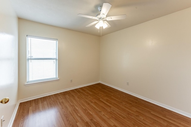 23222 Drywood Crossing Ct, Spring, TX 77373 - spare room featuring wood finished floors, baseboards, and ceiling fan
