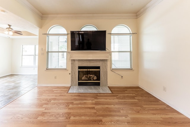 23222 Drywood Crossing Ct, Spring, TX 77373 - unfurnished living room featuring a ceiling fan, a fireplace, ornamental molding, wood finished floors, and baseboards