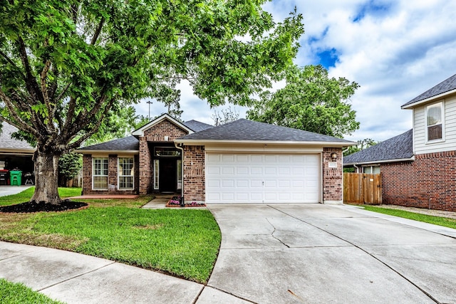 23222 Drywood Crossing Ct, Spring, TX 77373 - view of front of home with driveway, brick siding, and an attached garage