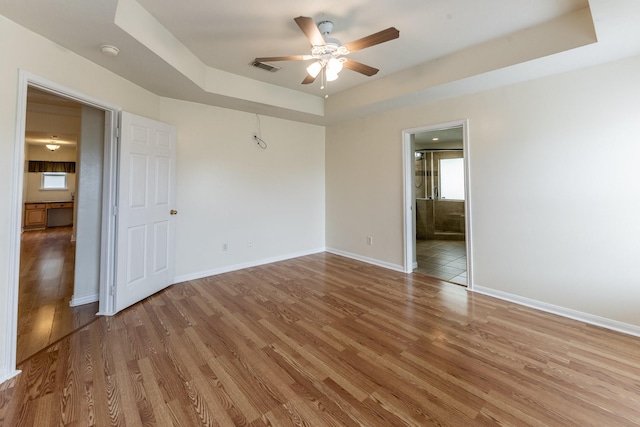 23222 Drywood Crossing Ct, Spring, TX 77373 - empty room with a raised ceiling, ceiling fan, wood finished floors, a smoke detector, and baseboards