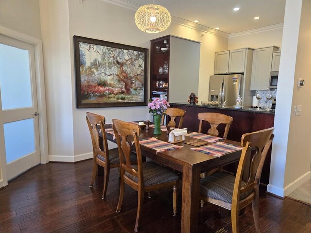 100 Willard St Unit 46, Houston, TX 77006 - dining area featuring crown molding, baseboards, and dark wood-style floors