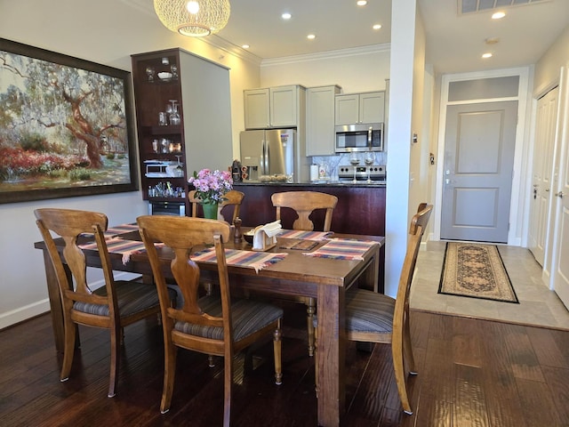 100 Willard St Unit 46, Houston, TX 77006 - dining room with recessed lighting, baseboards, ornamental molding, and wood finished floors