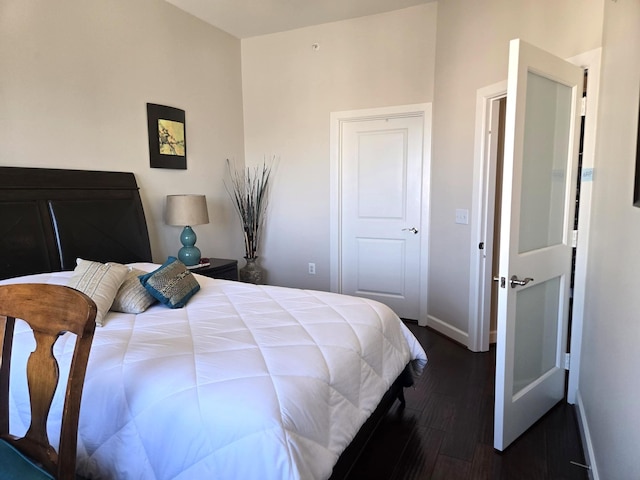 100 Willard St Unit 46, Houston, TX 77006 - bedroom featuring baseboards and dark wood-style floors