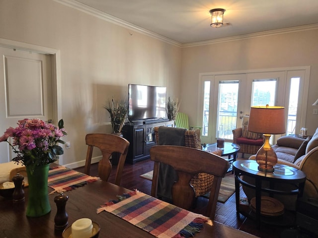 100 Willard St Unit 46, Houston, TX 77006 - dining space featuring baseboards, crown molding, and wood finished floors