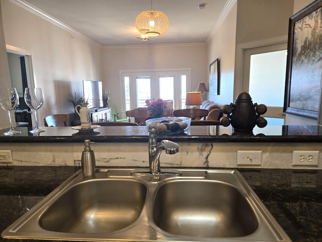100 Willard St Unit 46, Houston, TX 77006 - kitchen featuring dark stone countertops, open floor plan, french doors, crown molding, and a sink