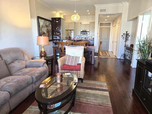 100 Willard St Unit 46, Houston, TX 77006 - living room with dark wood-type flooring, crown molding, baseboards, and visible vents