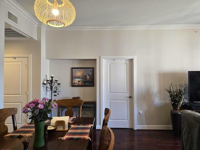 100 Willard St Unit 46, Houston, TX 77006 - dining room with a chandelier, visible vents, ornamental molding, and dark wood-style floors