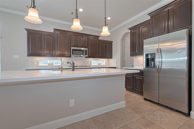kitchen with dark brown cabinets, light countertops, a sink, backsplash, and stainless steel appliances