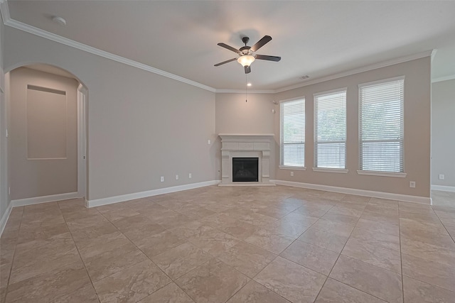 13207 Spurlin Meadow Dr, Tomball, TX 77377 - unfurnished living room with crown molding, arched walkways, ceiling fan, and baseboards