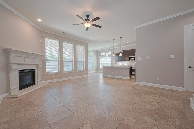 unfurnished living room with crown molding, ceiling fan, a glass covered fireplace, recessed lighting, and baseboards
