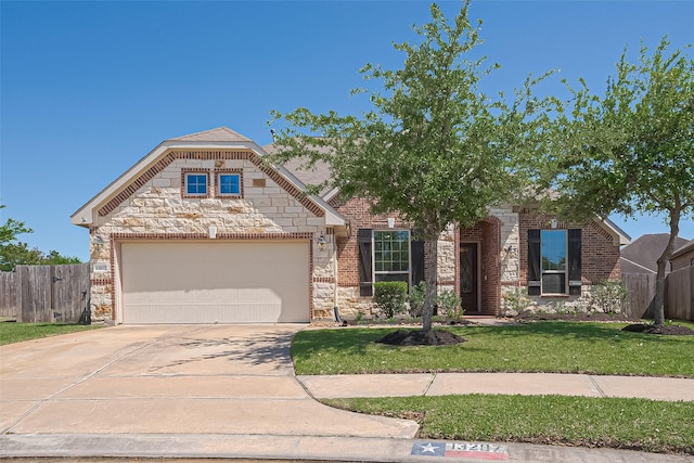 french provincial home with fence, an attached garage, stone siding, a front yard, and driveway