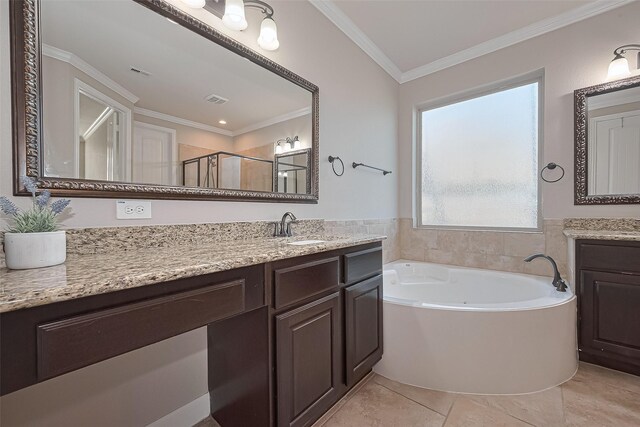 bathroom with crown molding, vanity, a shower stall, visible vents, and a garden tub