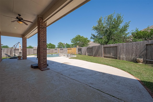 view of patio / terrace featuring a fenced in pool, a ceiling fan, and a fenced backyard