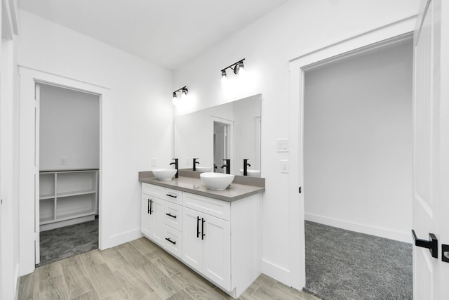 673 Rd 5822, Cleveland, TX 77327 - full bathroom featuring double vanity and baseboards