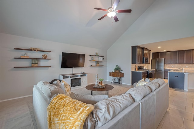 23806 Naples Shore Dr, Katy, TX 77493 - living room with high vaulted ceiling, light tile patterned flooring, ceiling fan, and baseboards