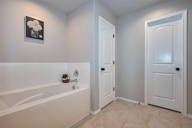 23806 Naples Shore Dr, Katy, TX 77493 - full bath with tile patterned flooring, baseboards, and a garden tub