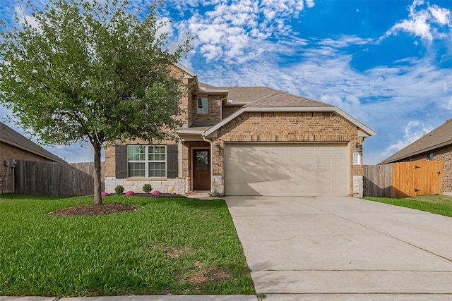 23806 Naples Shore Dr, Katy, TX 77493 - view of front of home featuring driveway, fence, stone siding, and a garage
