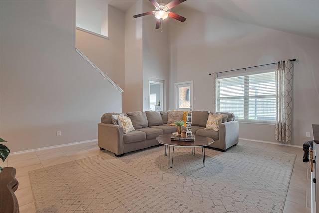 23806 Naples Shore Dr, Katy, TX 77493 - living room with high vaulted ceiling, light tile patterned floors, baseboards, and ceiling fan