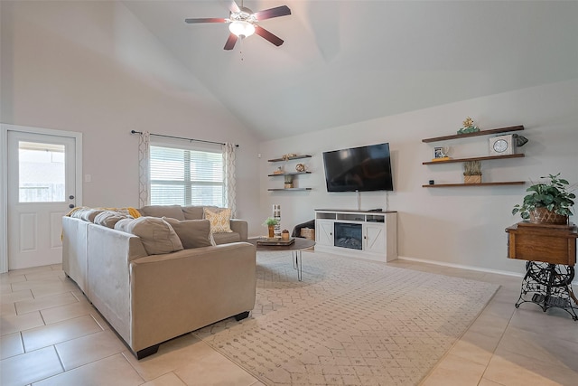 23806 Naples Shore Dr, Katy, TX 77493 - living area with baseboards, a ceiling fan, high vaulted ceiling, light tile patterned flooring, and a glass covered fireplace