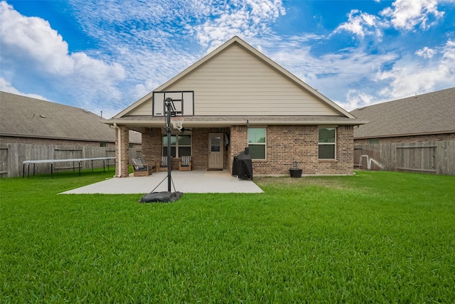 23806 Naples Shore Dr, Katy, TX 77493 - back of house featuring a patio area, brick siding, a fenced backyard, and a yard