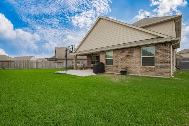 23806 Naples Shore Dr, Katy, TX 77493 - back of property with a patio area, a yard, a fenced backyard, cooling unit, and brick siding