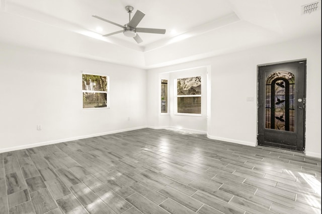312 N Alamo St, Alton, TX 78573 - empty room featuring a ceiling fan, wood finished floors, a raised ceiling, baseboards, and visible vents