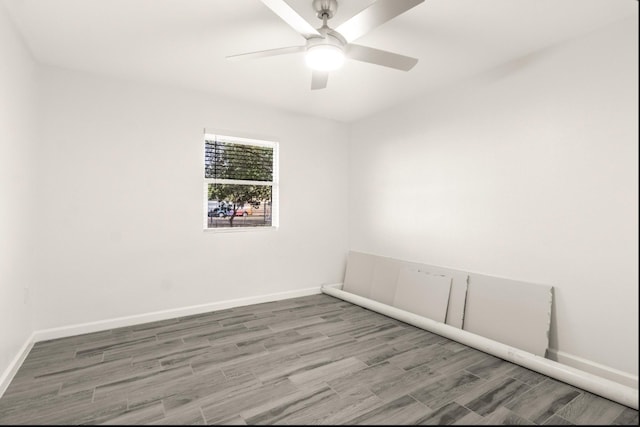 312 N Alamo St, Alton, TX 78573 - empty room with wood finished floors, baseboards, and ceiling fan